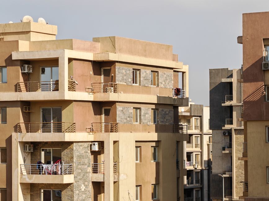 Sunlit view of modern urban apartment complex